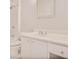 Bright bathroom featuring white cabinets, a shower and tub, and a framed mirror at 59 Saint Claire Ne Ln, Atlanta, GA 30324