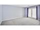 Spacious carpeted bedroom features a private entrance at 59 Saint Claire Ne Ln, Atlanta, GA 30324