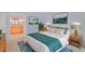 Cozy bedroom with modern decor, soft lighting, and a view of the en suite bathroom at 59 Saint Claire Ne Ln, Atlanta, GA 30324