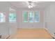 Bright dining room with wood floors, several windows, and a view into the living area at 59 Saint Claire Ne Ln, Atlanta, GA 30324