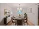 Elegant dining room with modern chandelier, large table, and stylish sideboard at 59 Saint Claire Ne Ln, Atlanta, GA 30324