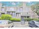 Attractive townhouse with manicured landscaping, covered entry, and convenient parking at 59 Saint Claire Ne Ln, Atlanta, GA 30324