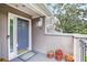 Inviting front entry with covered porch, attractive blue door, and decorative potted plants at 59 Saint Claire Ne Ln, Atlanta, GA 30324