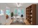 Functional home office with large window, desk, and shelving for storage at 59 Saint Claire Ne Ln, Atlanta, GA 30324