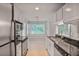 Updated kitchen boasts stainless steel appliances, modern cabinets, and an eat-in nook at 59 Saint Claire Ne Ln, Atlanta, GA 30324