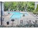 Community pool with lounge chairs and lush green surroundings, great for relaxation at 59 Saint Claire Ne Ln, Atlanta, GA 30324