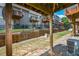 Backyard view of multi-level townhomes with wood decks and privacy fences at 2201 Landing Walk Dr, Duluth, GA 30097