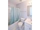 This bathroom features a shower-tub combo with a curtain, a white toilet, and a vanity with a mirror at 2201 Landing Walk Dr, Duluth, GA 30097