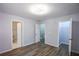 Bedroom with multiple doors that lead to a closet, bathroom, and stairway at 2201 Landing Walk Dr, Duluth, GA 30097