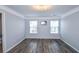Bedroom features wood floor, light colored walls, and white trim at 2201 Landing Walk Dr, Duluth, GA 30097