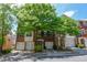 Brick townhome featuring black shutters, mature landscaping, and a convenient single-car garage at 2201 Landing Walk Dr, Duluth, GA 30097