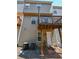 Rear exterior of townhouse with small wood decks and back entrance at 2201 Landing Walk Dr, Duluth, GA 30097