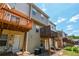 Rear exterior view of townhouses with wood decks and patios at 2201 Landing Walk Dr, Duluth, GA 30097