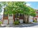 Charming brick townhome featuring black shutters and a convenient single-car garage at 2201 Landing Walk Dr, Duluth, GA 30097