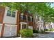 Charming brick townhome with a well-manicured yard and a one-car garage, perfect for suburban living at 2201 Landing Walk Dr, Duluth, GA 30097