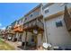 View of the exterior of a townhouse with private wood decks at 2201 Landing Walk Dr, Duluth, GA 30097