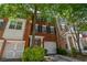 Charming brick townhome with a well-manicured yard and a one-car garage, perfect for suburban living at 2201 Landing Walk Dr, Duluth, GA 30097
