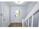 Entryway with sleek floors and white staircase, combining contemporary style and functional home design at 2201 Landing Walk Dr, Duluth, GA 30097