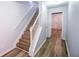 Bright entryway with hardwood floors, staircase, and neutral paint, creating an inviting, modern atmosphere at 2201 Landing Walk Dr, Duluth, GA 30097