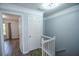 Hallway features stairway and doorways to bedroom at 2201 Landing Walk Dr, Duluth, GA 30097