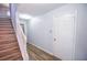 Inviting foyer features stylish hardwood floors and staircase to upper level, blending functionality with modern design at 2201 Landing Walk Dr, Duluth, GA 30097