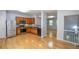 Open-concept kitchen with stainless steel appliances, wood cabinets, and view to the next room at 2201 Landing Walk Dr, Duluth, GA 30097