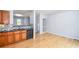 Modern kitchen with wood cabinets, dark countertop, and open view at 2201 Landing Walk Dr, Duluth, GA 30097