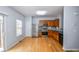 Well-lit kitchen with stainless steel appliances, wood cabinets, and backsplash at 2201 Landing Walk Dr, Duluth, GA 30097