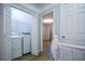 A second floor laundry area is adjacent to a linen closet and a bedroom at 2201 Landing Walk Dr, Duluth, GA 30097