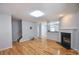 Open-concept living room boasts hardwood floors and a fireplace, perfect for gatherings at 2201 Landing Walk Dr, Duluth, GA 30097