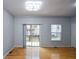 Bright living room with hardwood floors, large sliding door and window offering plenty of natural light at 2201 Landing Walk Dr, Duluth, GA 30097
