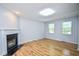 Inviting living room highlighted by a fireplace, hardwood floors, and natural lighting at 2201 Landing Walk Dr, Duluth, GA 30097