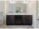 Bathroom with a double vanity, a large mirror, and plenty of storage space at 3231 Chutney Ct, Avondale Estates, GA 30002