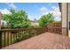 Outdoor wooden deck with railing, offering a view of the surrounding trees and neighborhood at 3231 Chutney Ct, Avondale Estates, GA 30002