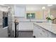 Stylish kitchen features white cabinetry, granite countertops, and stainless-steel appliances at 3231 Chutney Ct, Avondale Estates, GA 30002