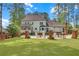 Spacious backyard with a swimming pool, patio, and lush green lawn at 4985 Miller Sw Rd, Lilburn, GA 30047