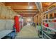 Unfinished basement with exposed beams, concrete walls and floor, and storage space at 4985 Miller Sw Rd, Lilburn, GA 30047