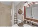 Bathroom featuring granite countertop, shower, toilet, and decor at 4985 Miller Sw Rd, Lilburn, GA 30047