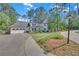 Well-maintained two-story home featuring an attached garage and a neatly manicured lawn at 4985 Miller Sw Rd, Lilburn, GA 30047