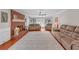 Inviting living room features a brick fireplace, hardwood floors and comfortable seating arrangements at 4985 Miller Sw Rd, Lilburn, GA 30047