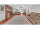 Spacious living room with a brick fireplace, hardwood floors, and open layout at 4985 Miller Sw Rd, Lilburn, GA 30047
