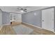 Versatile living space with wood floors, gray walls, and natural light at 4985 Miller Sw Rd, Lilburn, GA 30047