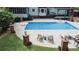 Backyard pool features lounge seating, diving board, and brick pillar accents at 4985 Miller Sw Rd, Lilburn, GA 30047