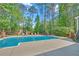 Outdoor swimming pool with lounge chairs and a landscaped backyard at 4985 Miller Sw Rd, Lilburn, GA 30047