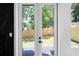 A view of the backyard through the modern glass panel back door at 88 Cleveland Unit B Se St, Atlanta, GA 30316