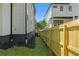 Exterior shot shows the side of the home with a newly installed wooden fence and well-maintained lawn at 88 Cleveland Unit B Se St, Atlanta, GA 30316