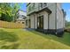 Spacious backyard showing the home's exterior, a well-kept lawn, and a wooden privacy fence at 88 Cleveland Unit B Se St, Atlanta, GA 30316