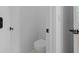 Clean, minimalist half bathroom with a toilet tucked into a corner at 88 Cleveland Unit B Se St, Atlanta, GA 30316