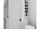 Bathroom featuring a toilet and a vanity with white countertop, and contemporary black and white art at 88 Cleveland Unit B Se St, Atlanta, GA 30316