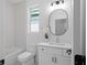 Stylish bathroom featuring modern vanity, mirror, and shower-tub combo at 88 Cleveland Unit B Se St, Atlanta, GA 30316